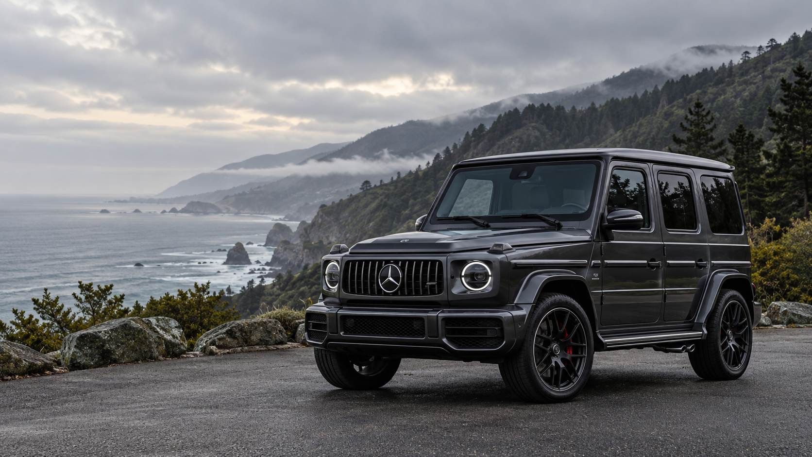 Illustrative graphite Mercedes-Benz G-Class at a misty coastal overlook